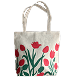 a white jute bag with red flowers on it