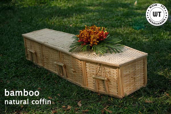 a bamboo natural coffin on the grass